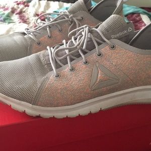 Purple and orange Reebok sneakers